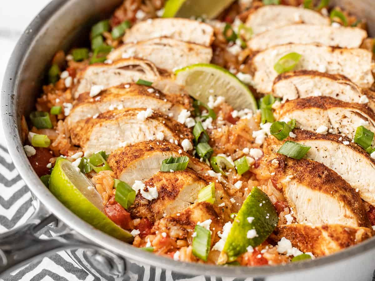 Side view of chipotle lime chicken and rice in a skillet