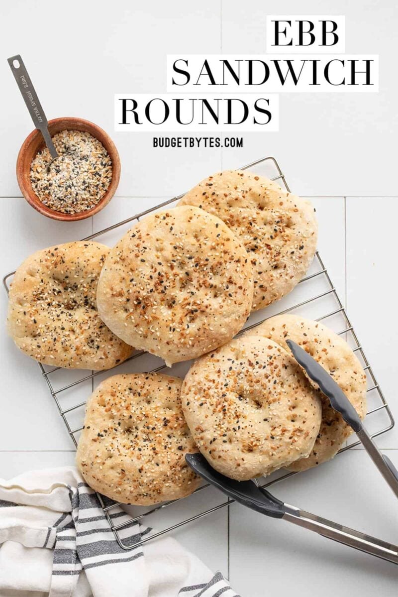 Everything bagel seasoning sandwich rounds on a cooling rack, title text at the top