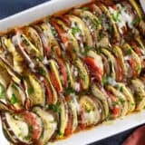 Overhead view of a baking dish filled with layers of oven-roasted ratatouille.