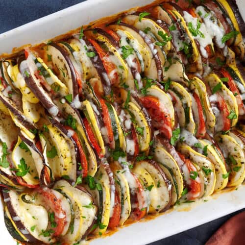 Overhead view of a baking dish filled with layers of oven roasted ratatouille.