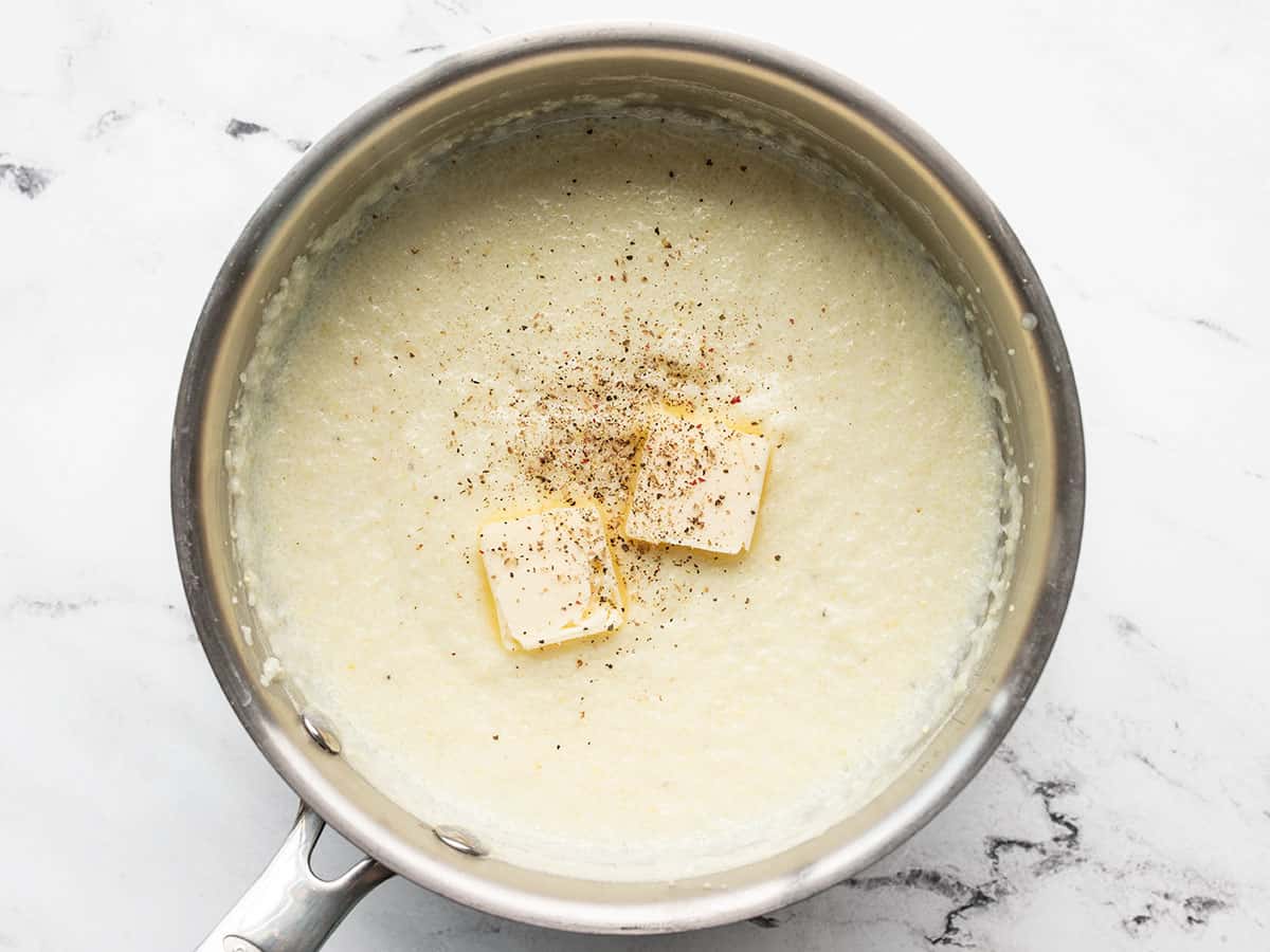 butter and pepper added to the grits