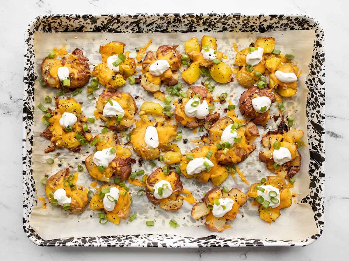 Final smashed potatoes topped with sour cream and green onion