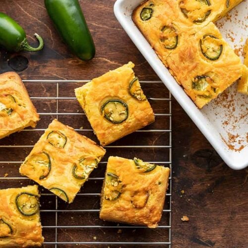 Jalapeño Cheddar Cornbread half in the baking dish and half on a cooling rack