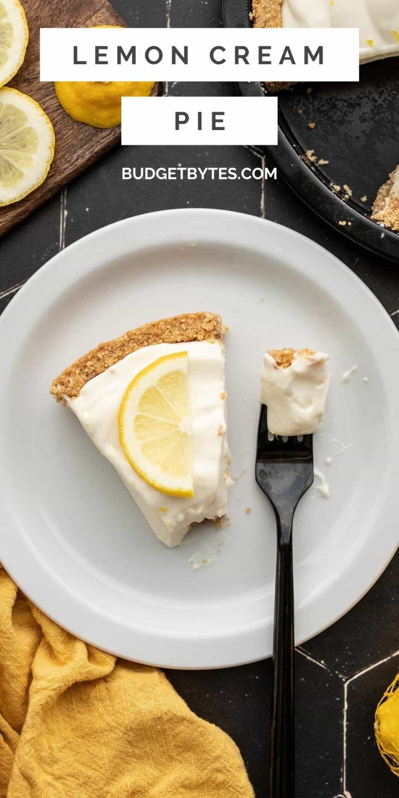 one slice of lemon cream pie on a plate with a fork