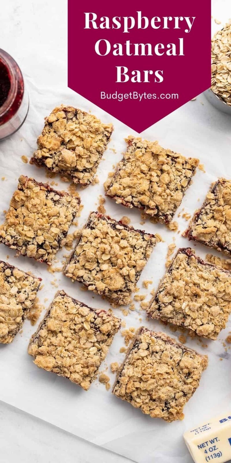 Overhead view of cut raspberry oatmeal bars, title text at the top