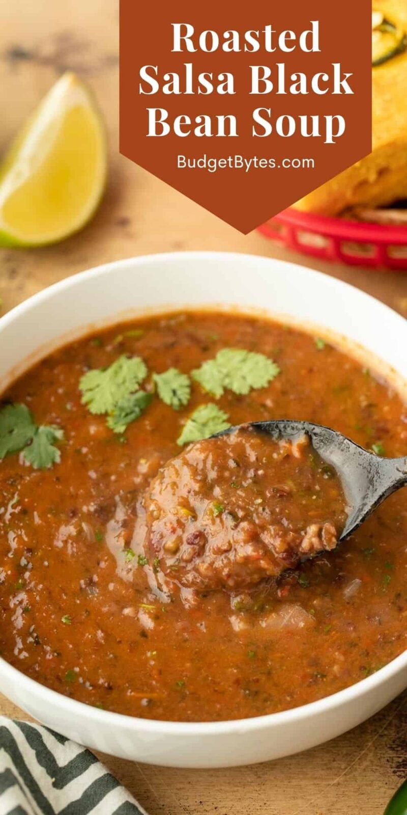 Close up of a bowl of roasted salsa and black bean soup, title text at the top