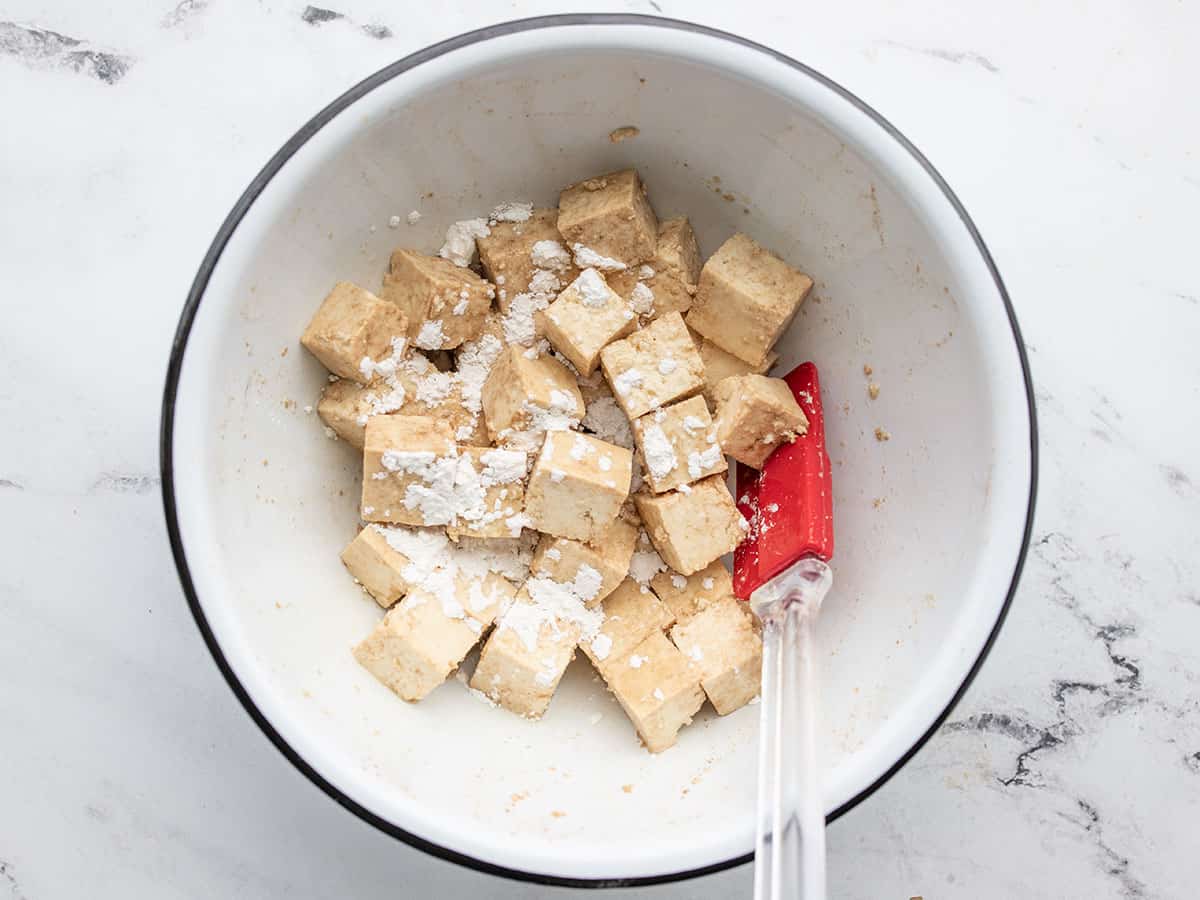 cubed tofu in the bowl with cornstarch