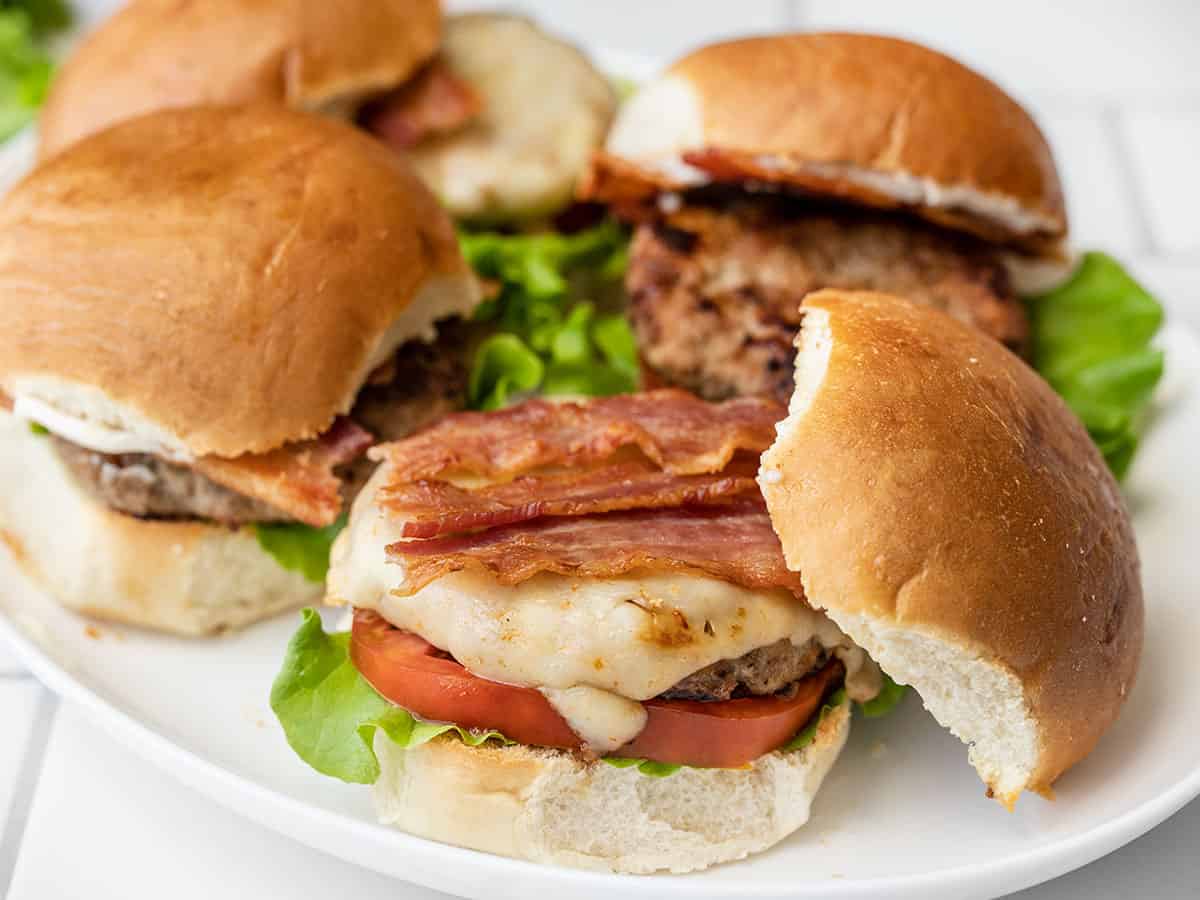 Side view of a platter full of bacon ranch turkey burgers