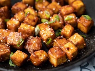 Close up of honey sriracha tofu in the skillet