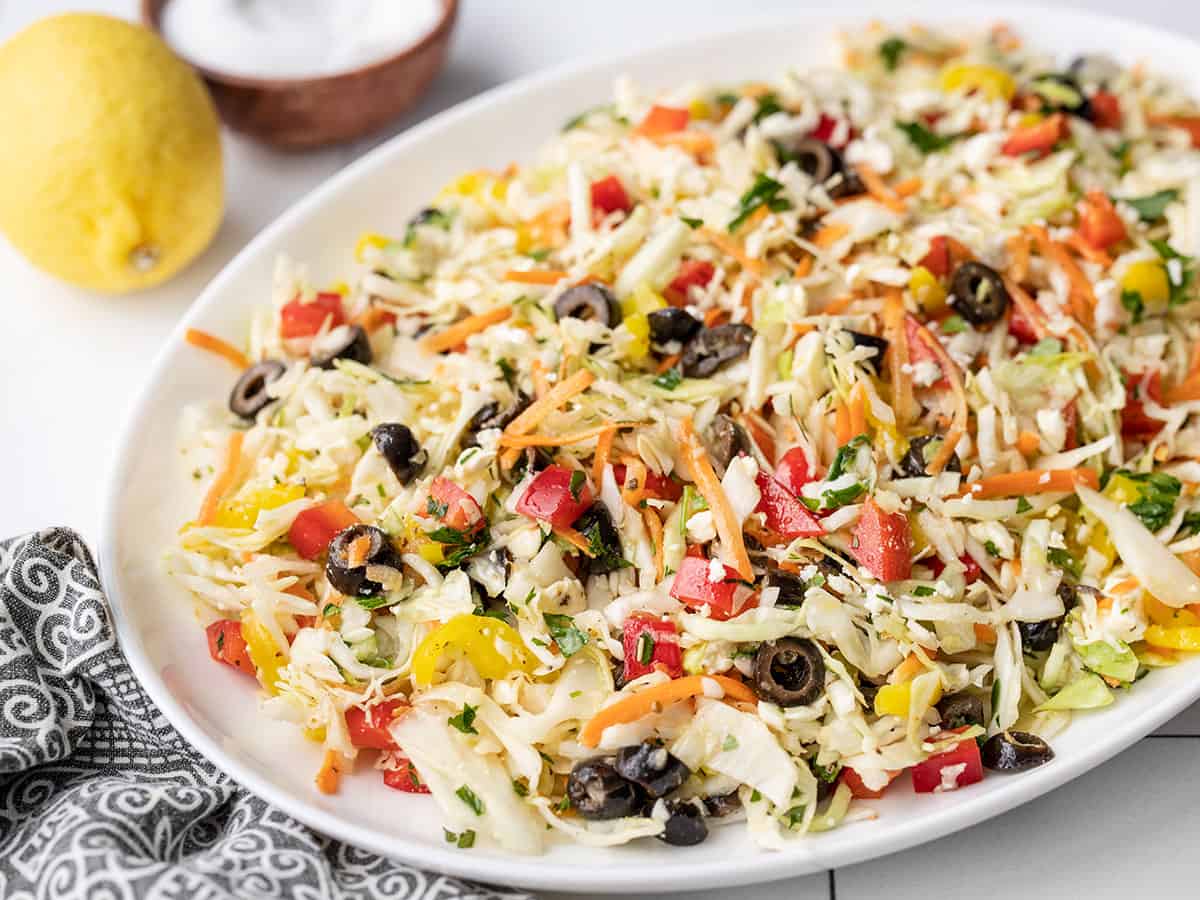 Side view of mediterranean coleslaw in a serving dish