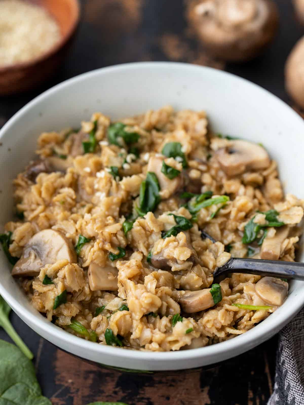 close up side view of a bowl of savory oatmeal