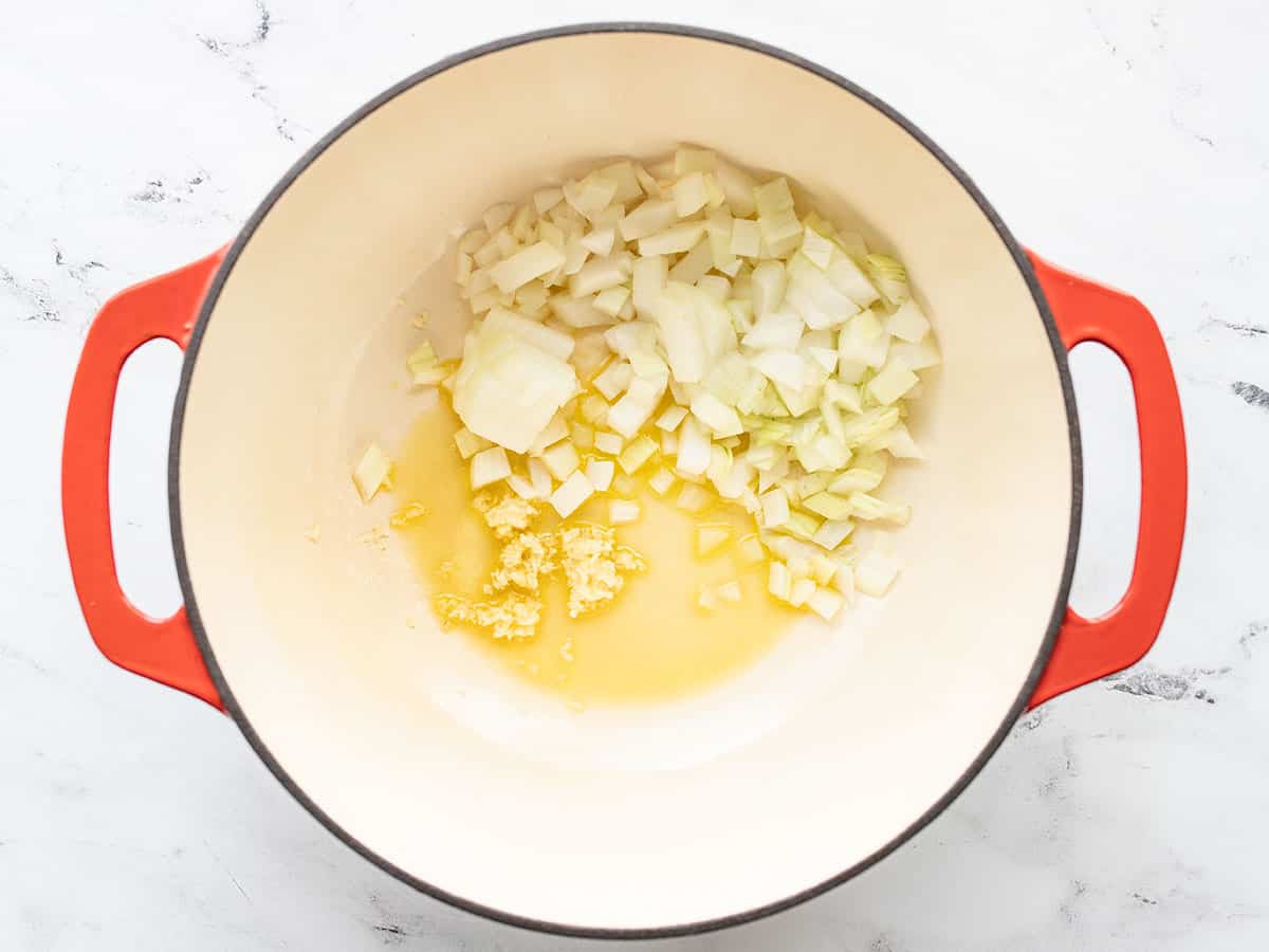 diced onion and minced garlic in a pot with olive oil