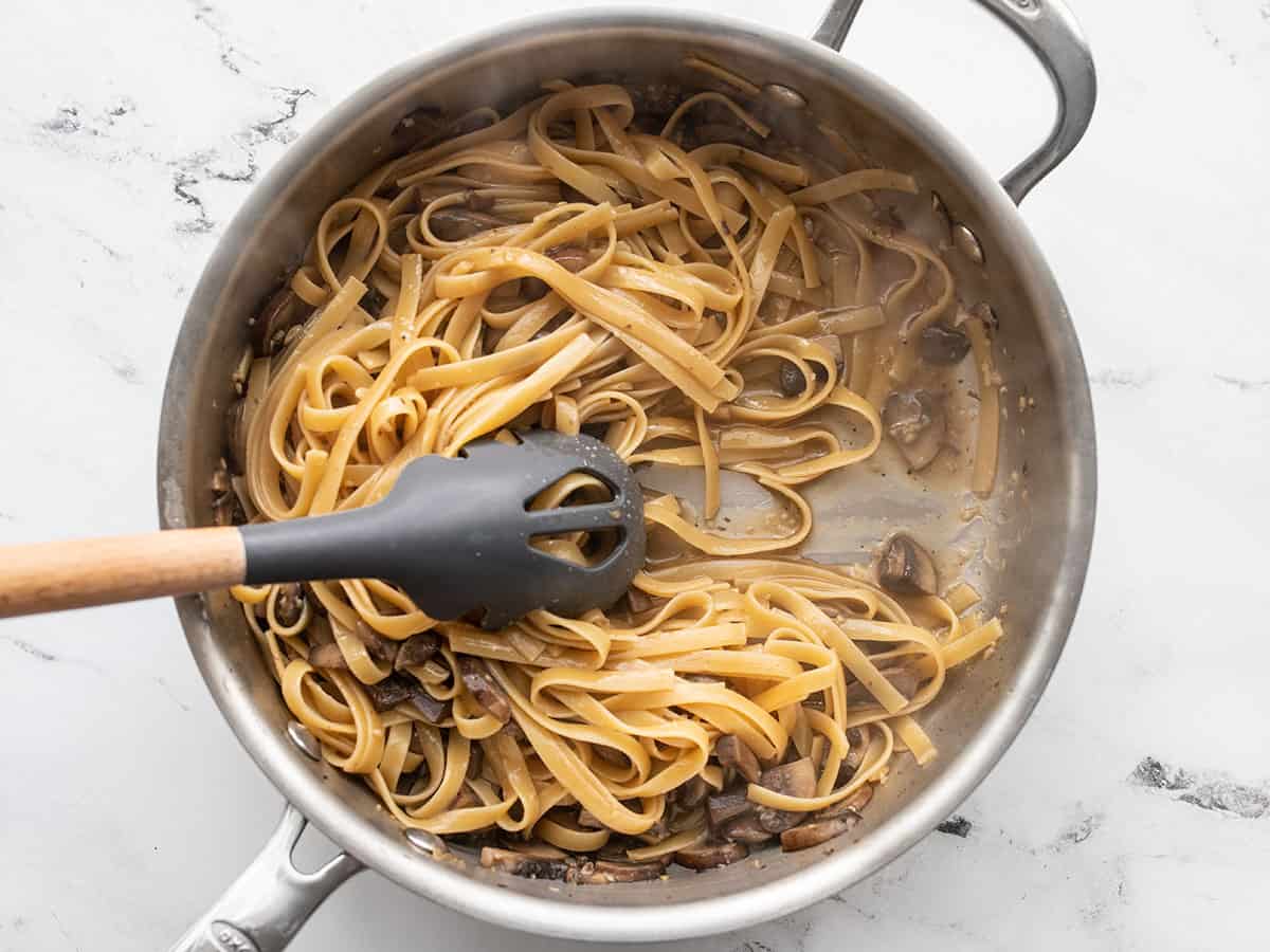 Cooked Pasta being pulled to the side with a pasta spoon