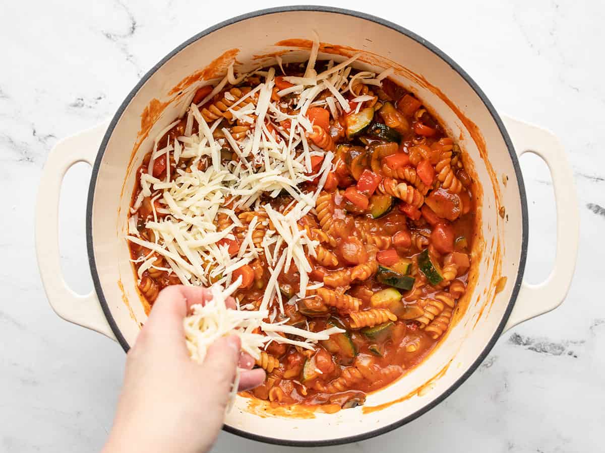 Shredded cheese being added on top