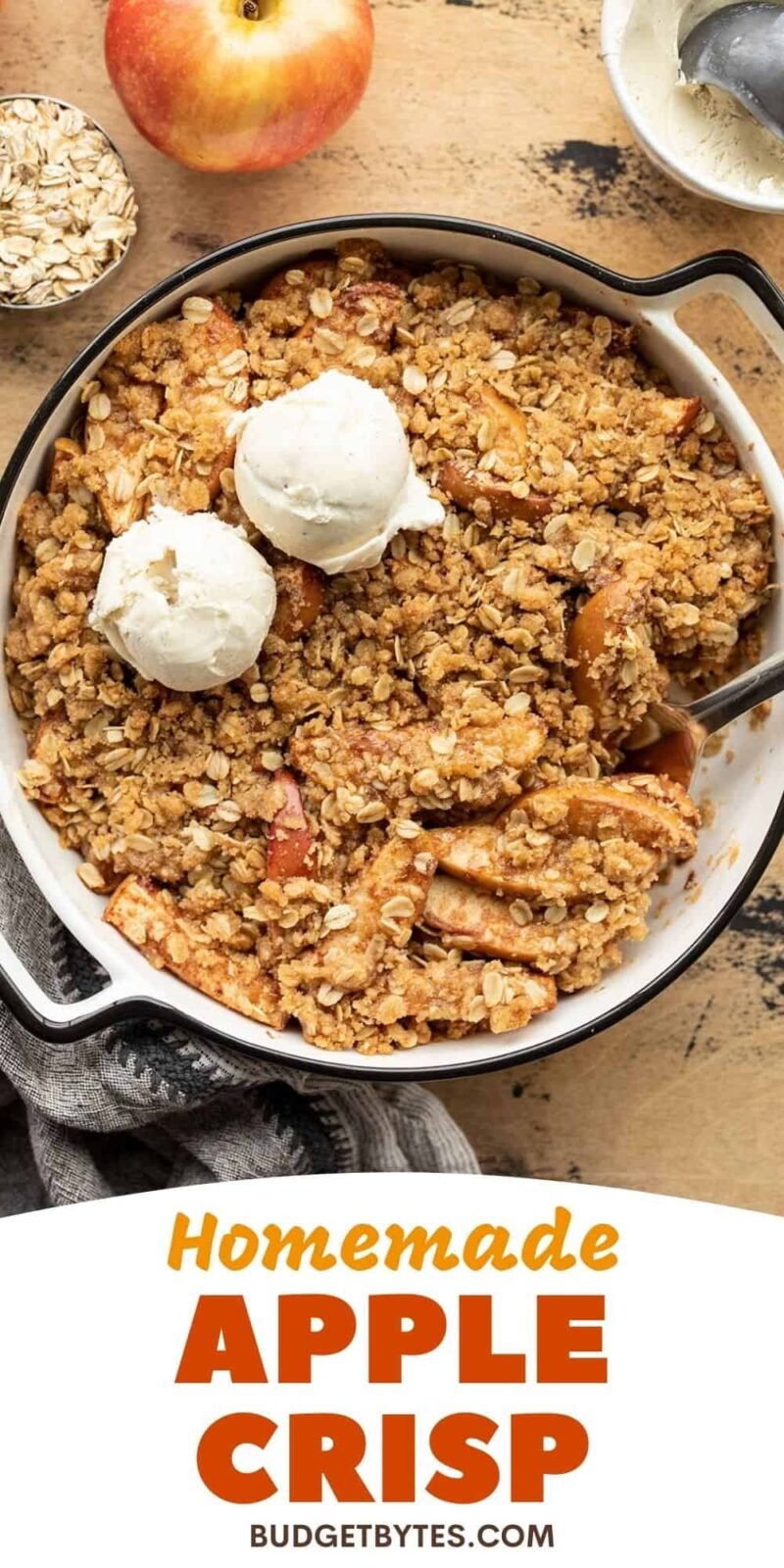 apple crisp in the baking dish with ice cream, title text at the bottom