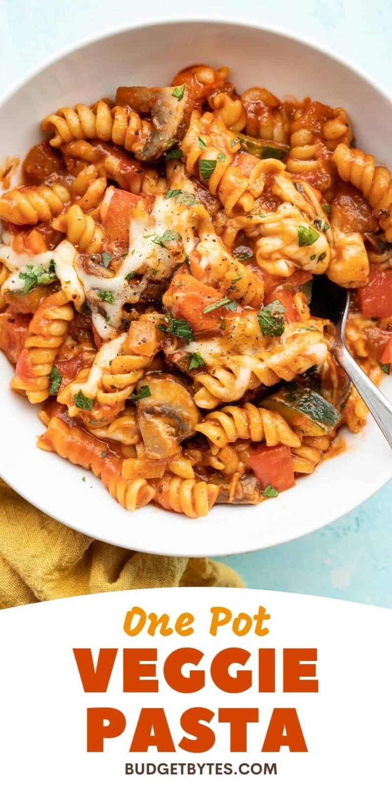 overhead view of a bowl of veggie pasta, title text at the bottom