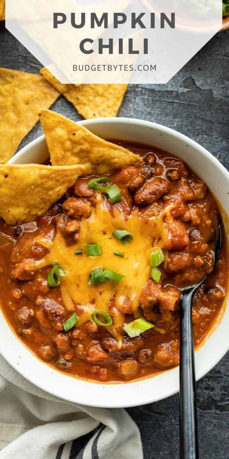 Overhead view of a bowl of pumpkin chili, title text at the top