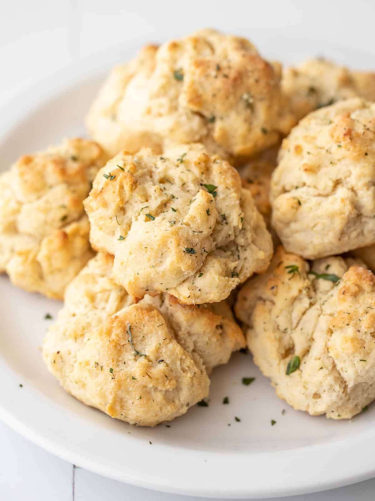Side view of a stack of ranch drop biscuits on a plate