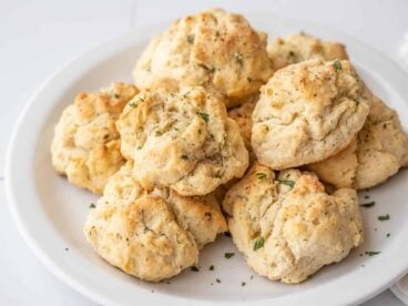 side view of ranch drop biscuits on a plate