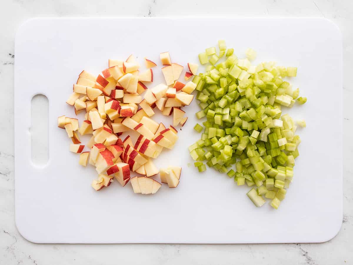 Chopped apple and celery on a cutting board