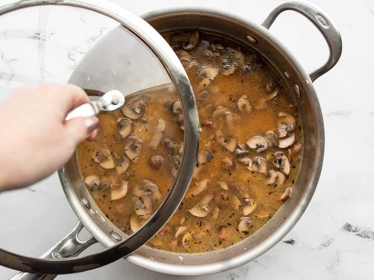 Lid being added to the pan