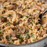 Close side view of mushroom rice in a pan