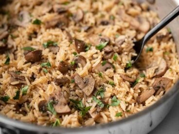 Close side view of mushroom rice in a pan