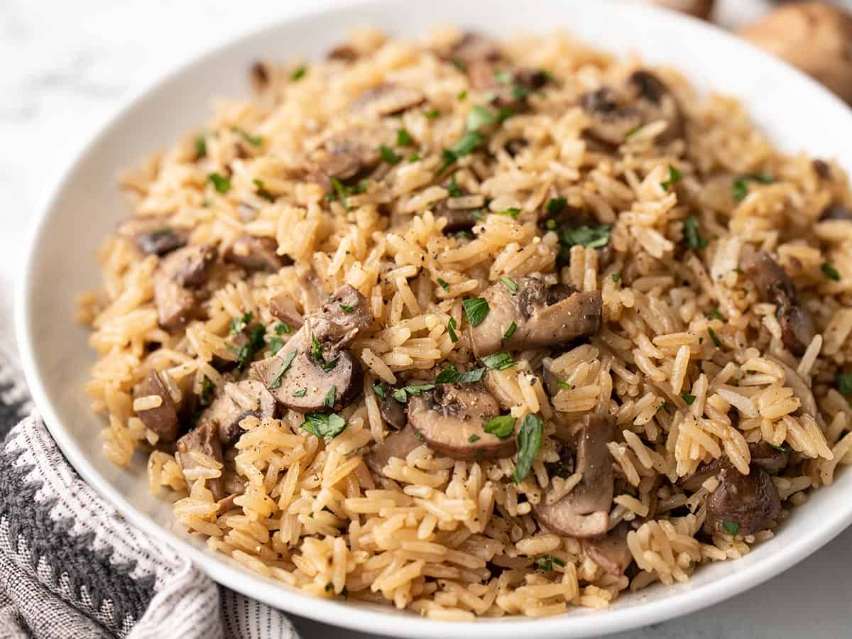 Side view of mushroom rice in a serving bowl