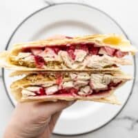 Thanksgiving leftovers tortilla wrap cut in half facing the camera