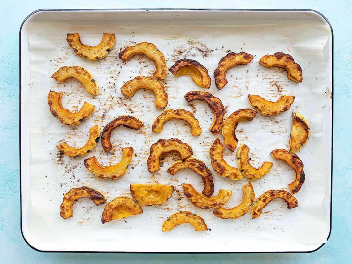 Roasted delicata squash on the baking sheet