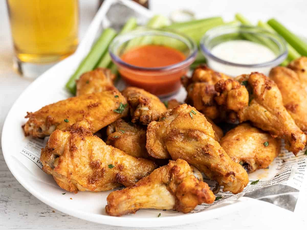 Side view of a platter of baked chicken wings