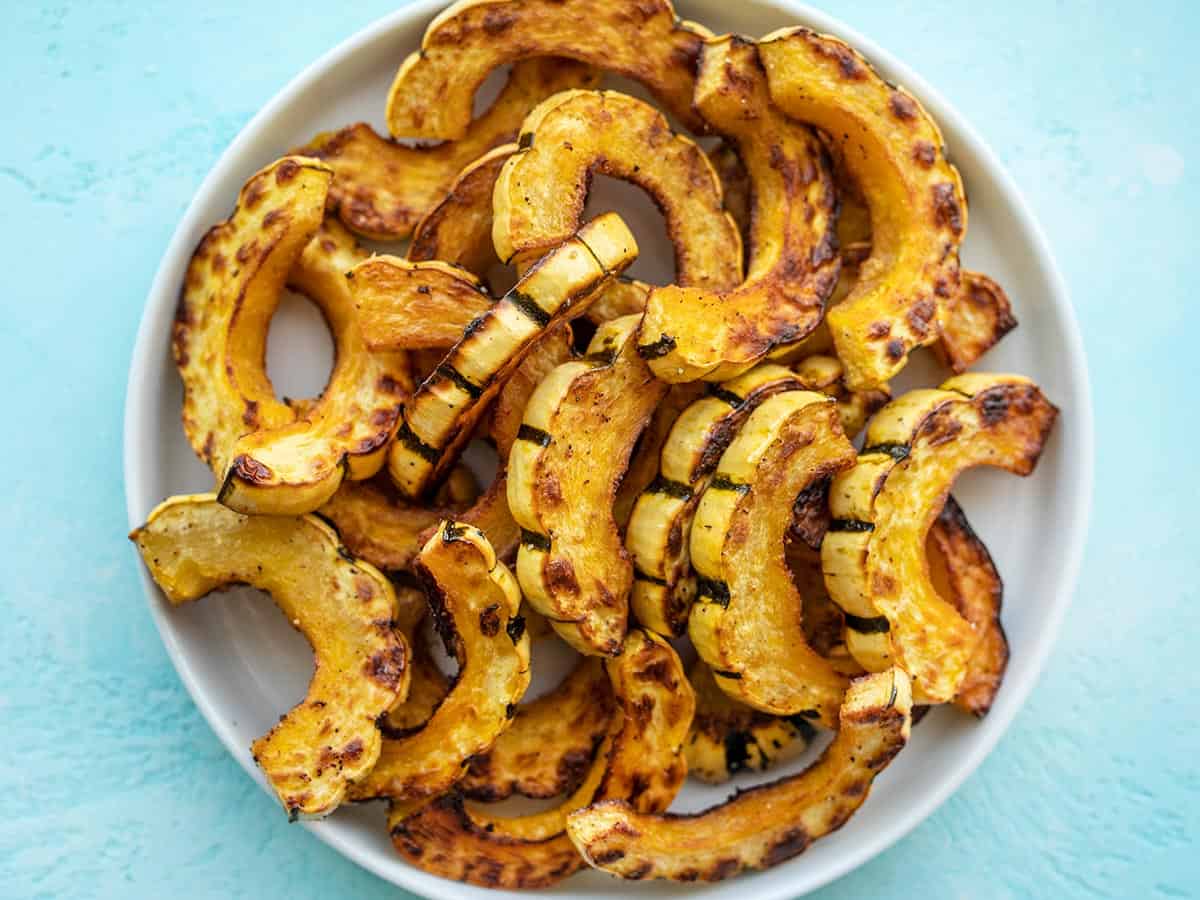 overhead view of roasted delicata squash on a plate