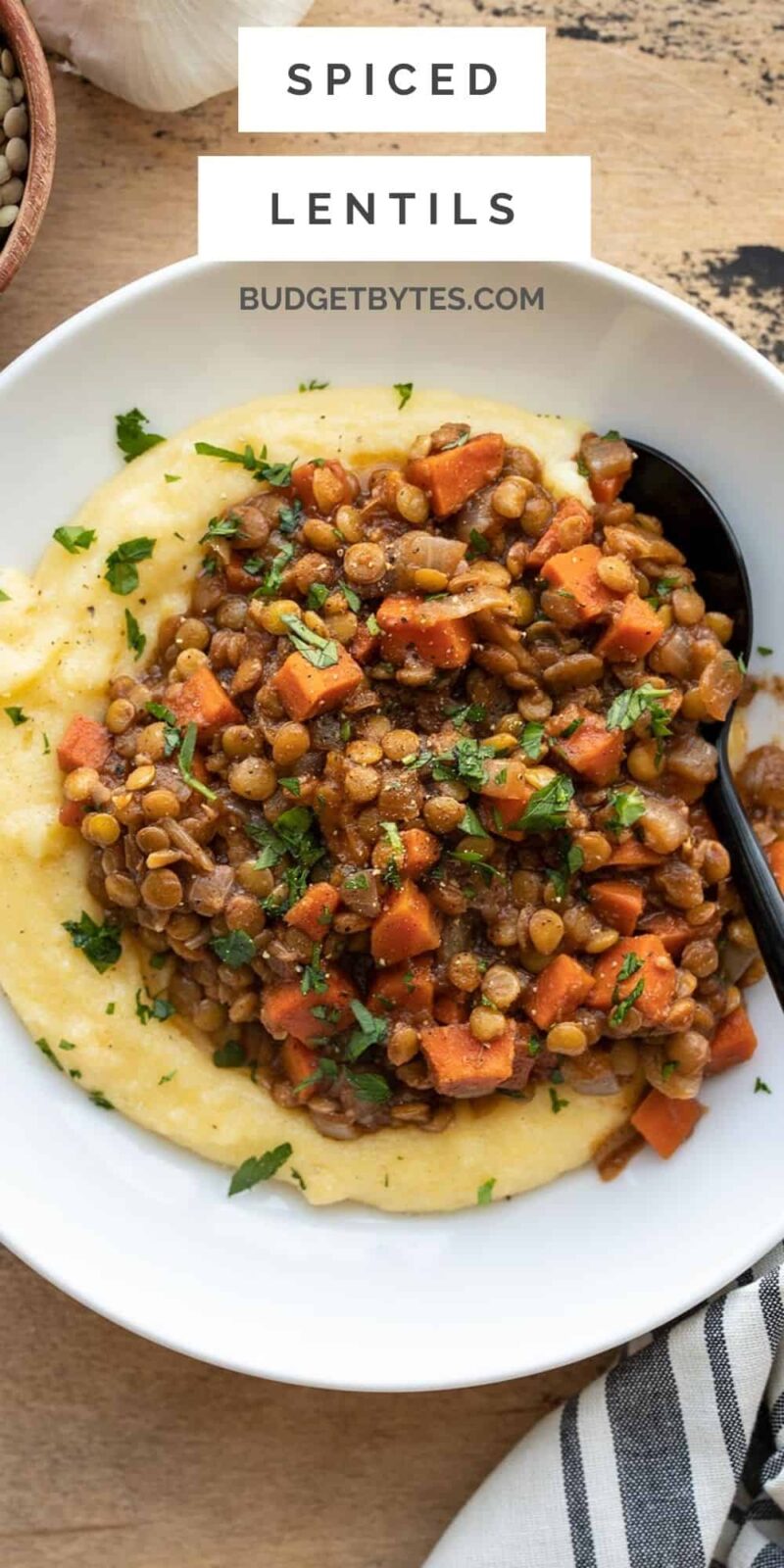 spiced lentils over a bed of polenta, title text at the top