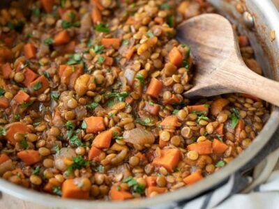 close up side view of spiced lentils in the skillet