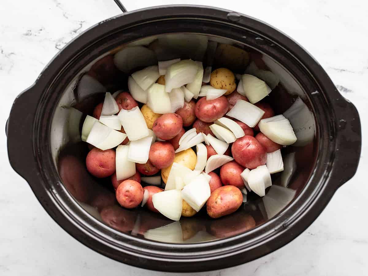 Onion and potatoes in the slow cooker
