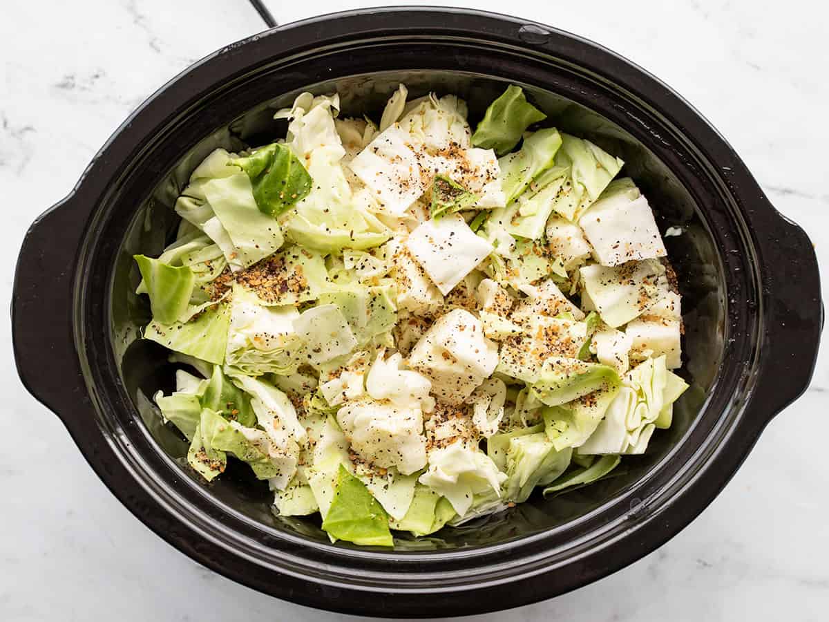 cabbage and steak seasoning added to the slow cooker