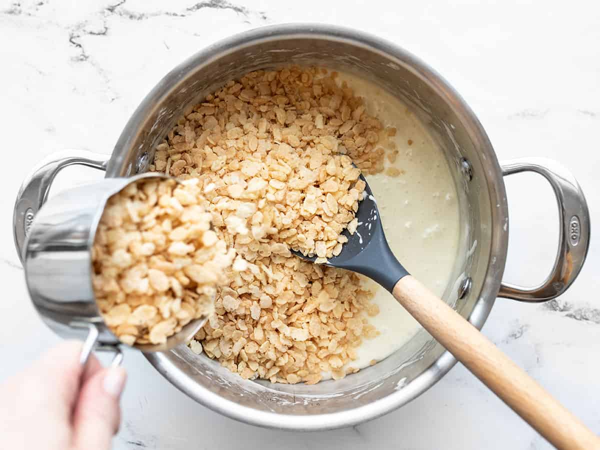 Rice krispies being added to the pot