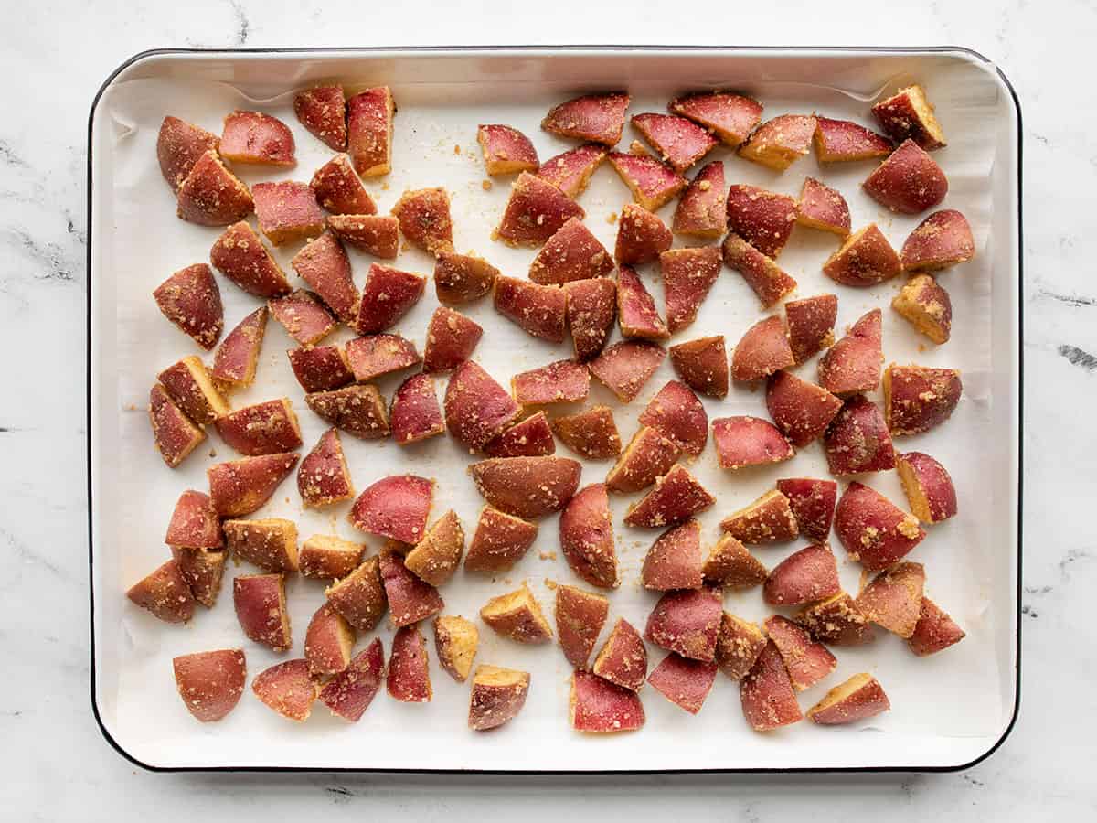 seasoned potatoes on a baking sheet