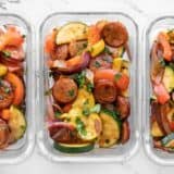 rectangular glass containers with Cajun Sausage and Vegetables lined up