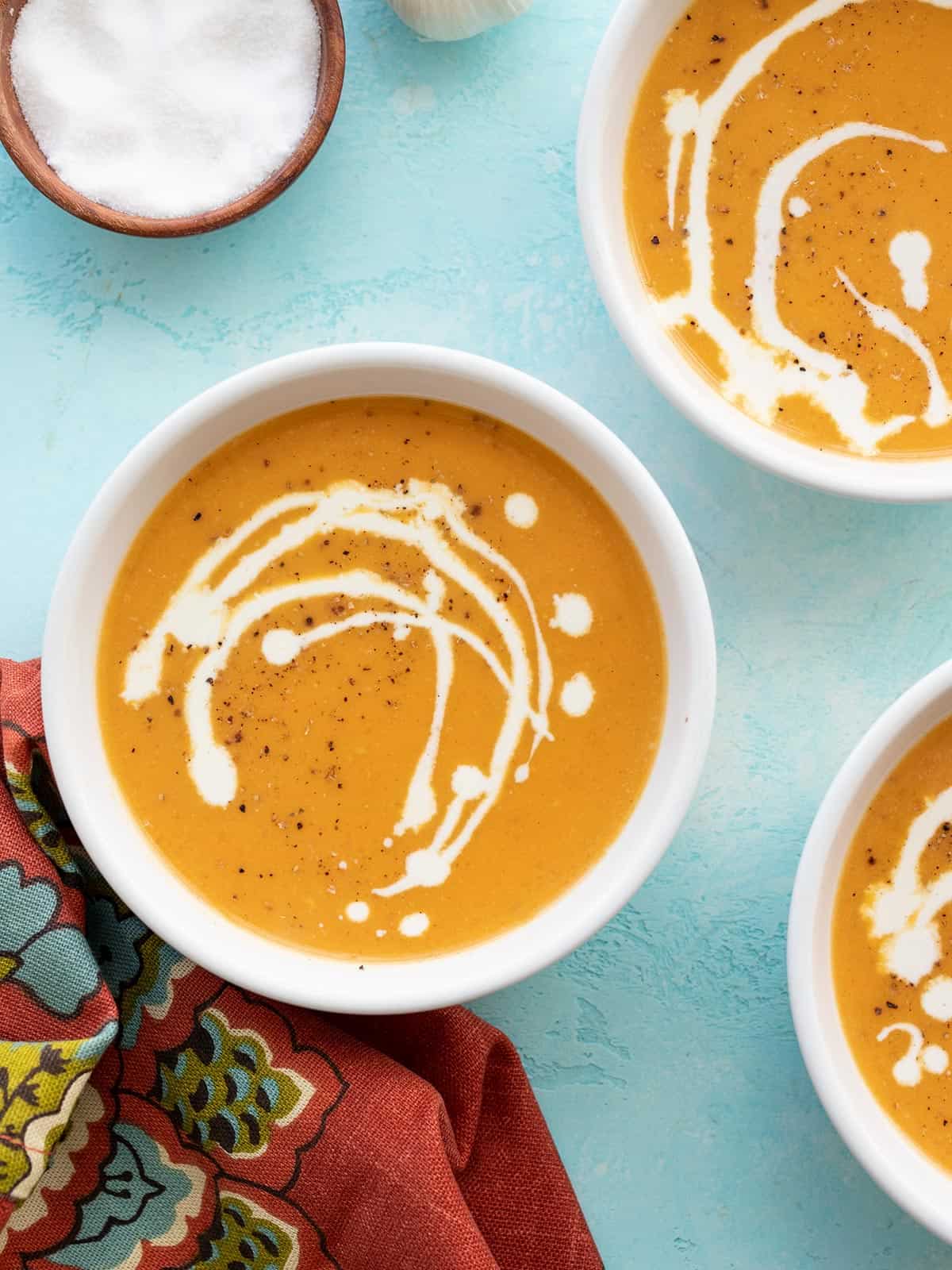 three bowls of sweet potato soup