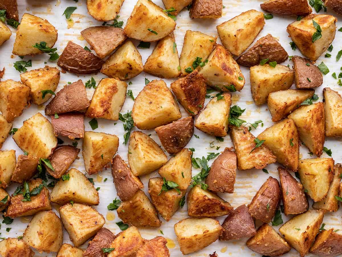 close up of parmesan roasted potatoes garnished with parsley