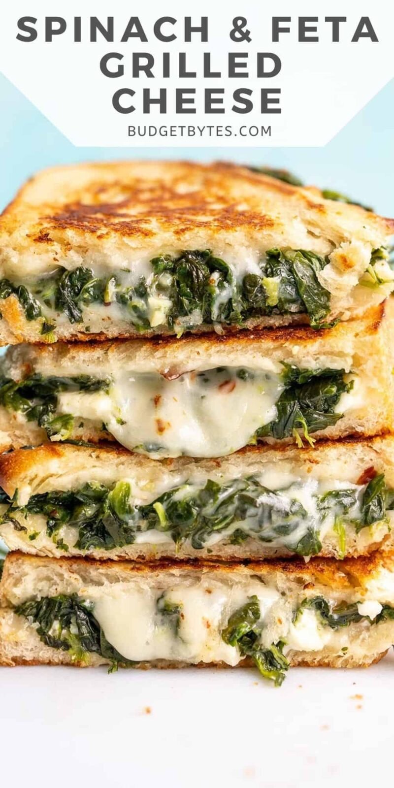 A stack of spinach and feta grilled cheeses