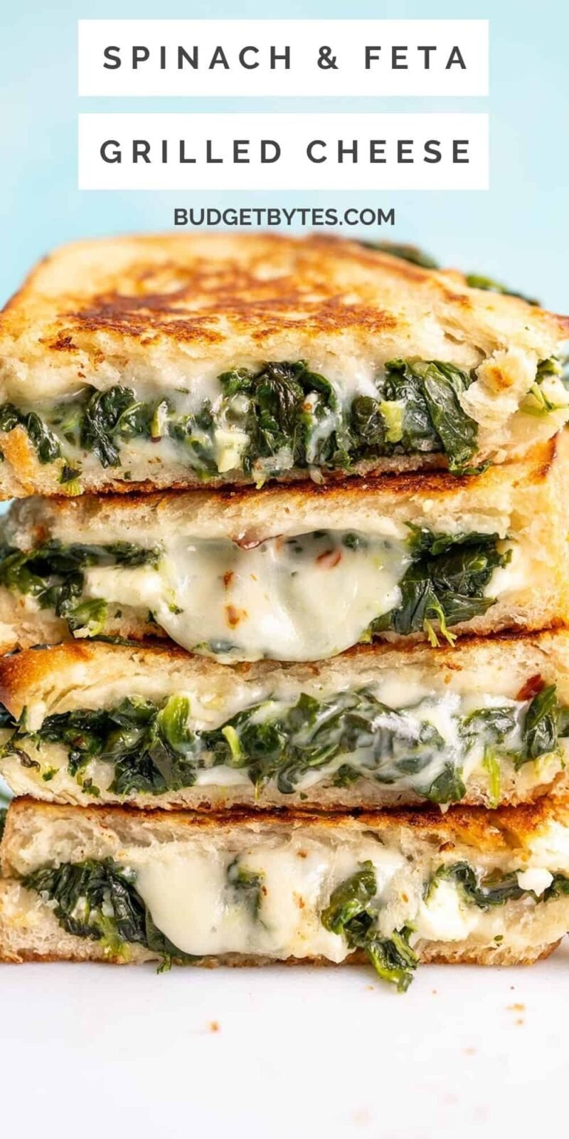 A stack of spinach and feta grilled cheeses