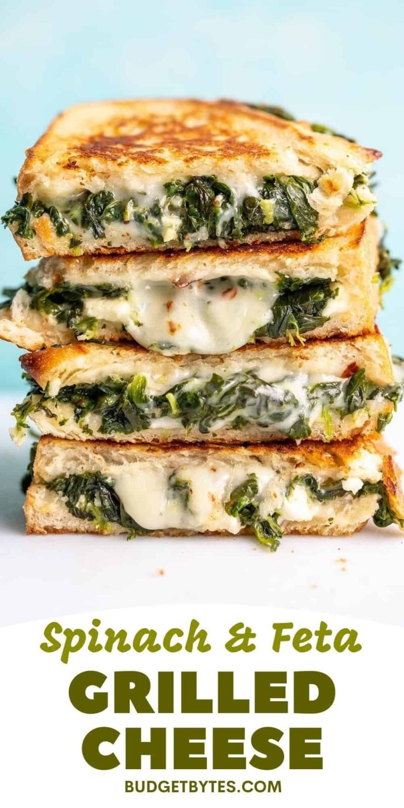 A stack of spinach and feta grilled cheeses