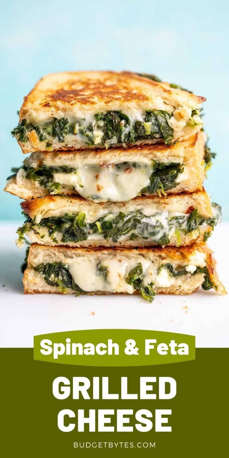 A stack of spinach and feta grilled cheeses