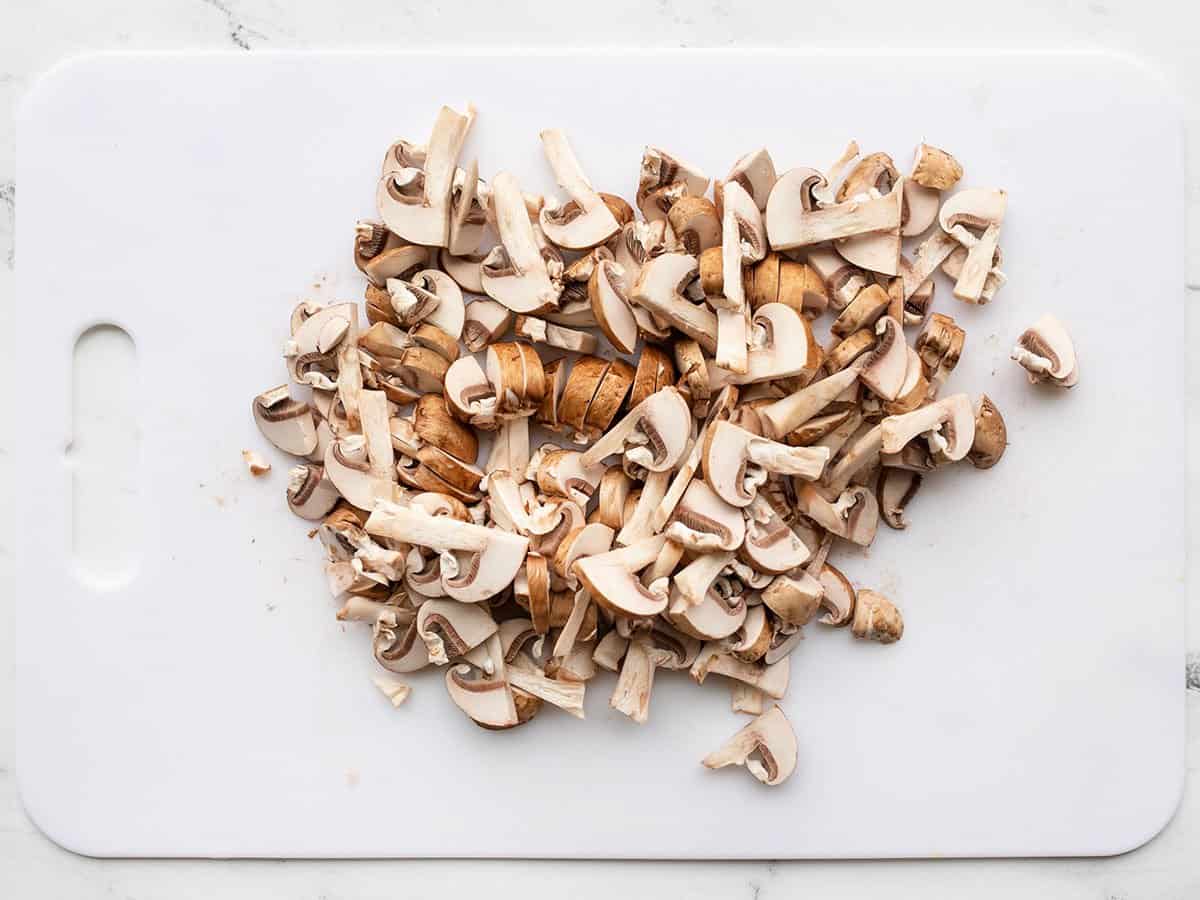 Sliced mushrooms on a cutting board