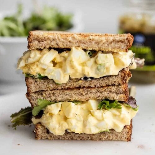 Egg salad sandwich cut in half and stacked