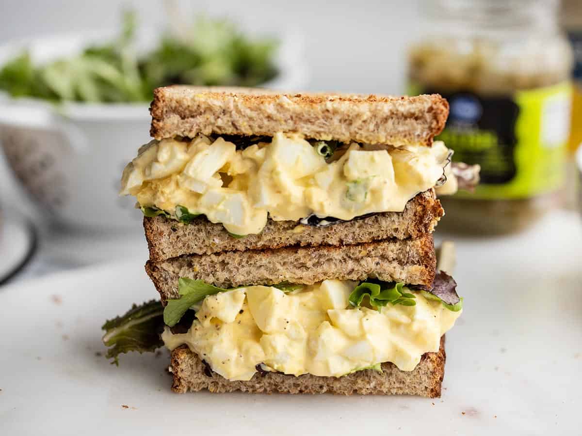Egg salad sandwich cut in half and stacked