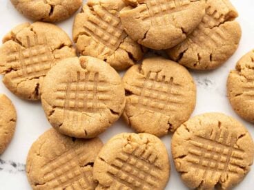 flourless peanut butter cookies scattered on a surface