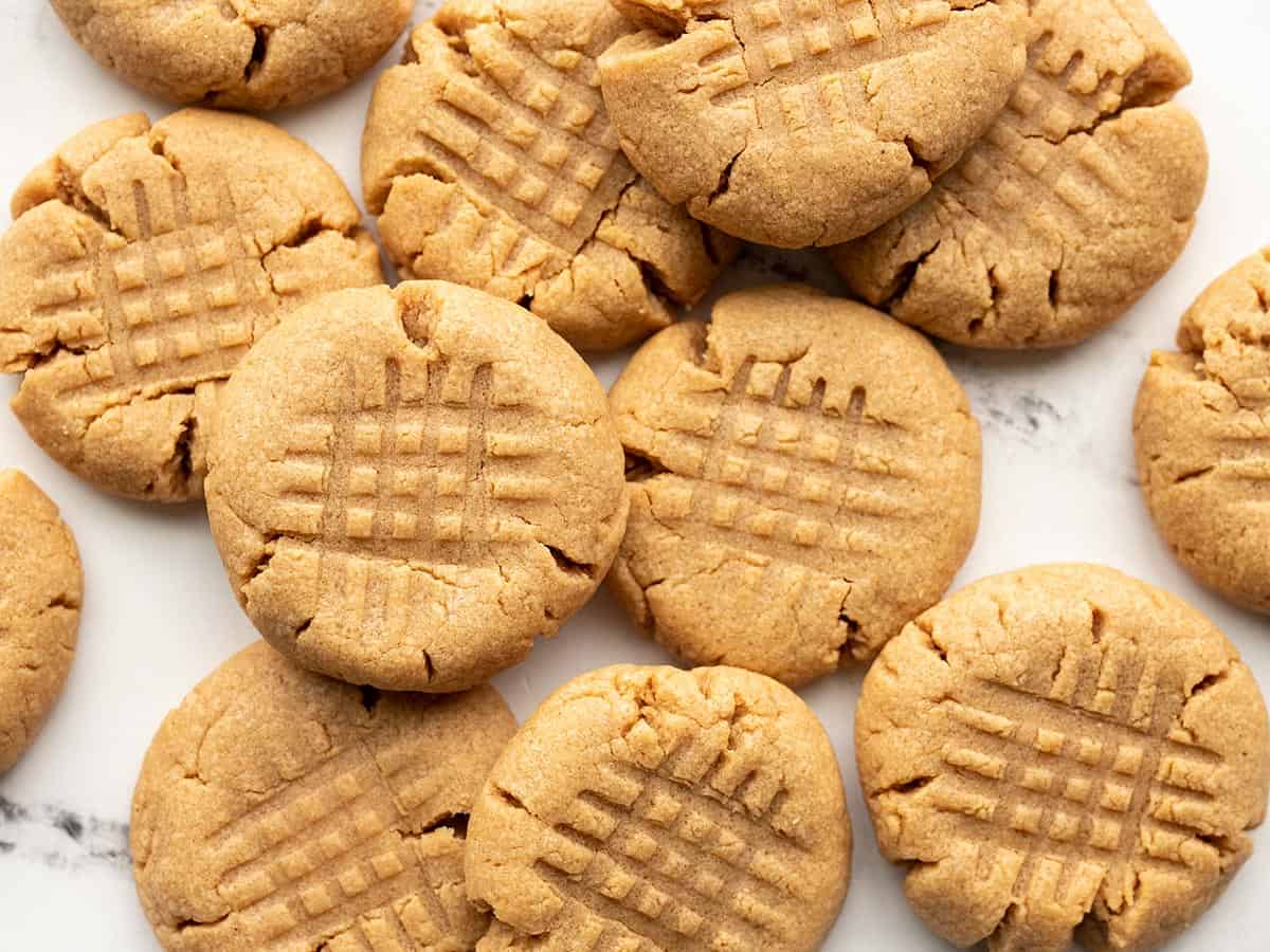 Flourless peanut butter cookies scattered on a surface